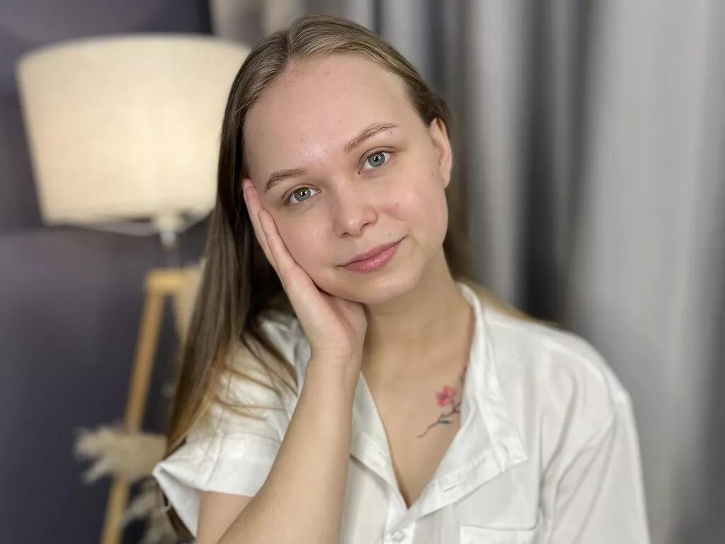 ElwynaBucher — Like: Sincere conversations, music, playful flirting, and mysterious smiles.